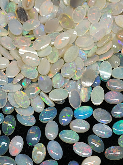 54068.0 - 6x4 mm Natural Sold White Australian Opal Oval Cabochon Cut in a Mixed Quality