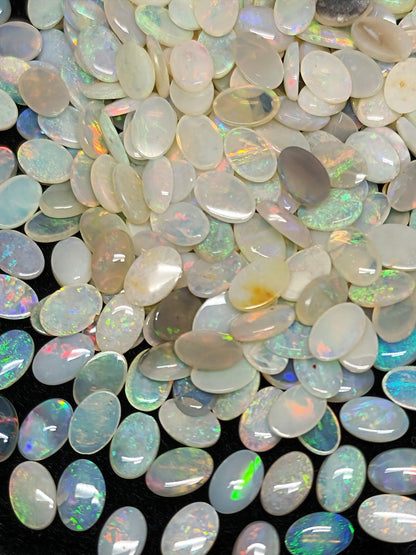 54068.0 - 6x4 mm Natural Sold White Australian Opal Oval Cabochon Cut in a Mixed Quality