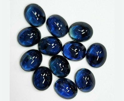 14050.0 - Australian Cabochon Blue Sapphires. Mined, Cut and Polished in Australia. Approximately 6.50 x 5.25 mm and Approx. 1 carat each