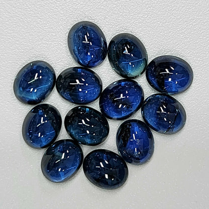 14050.0 - Australian Cabochon Blue Sapphires. Mined, Cut and Polished in Australia. Approximately 6.50 x 5.25 mm and Approx. 1 carat each