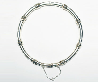 11912.0 - Sterling Silver 4.4 mm Round Tube Hinged Bangle with Safety Chain 65 mm Internal Diameter when closed About 15 grams