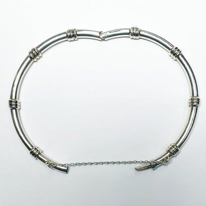 11912.0 - Sterling Silver 4.4 mm Round Tube Hinged Bangle with Safety Chain 65 mm Internal Diameter when closed About 15 grams