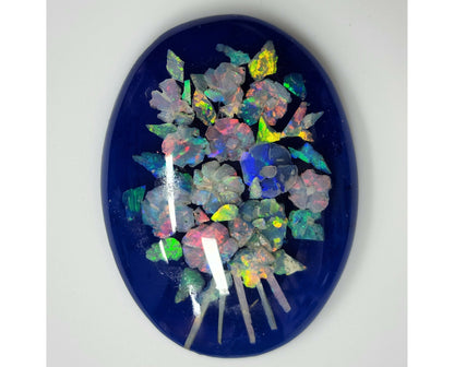 53675.0 - A Boquet of Flowers Created with Carved Australian Opal Chips embedded in Resin against a Blue Background 40x30 mm