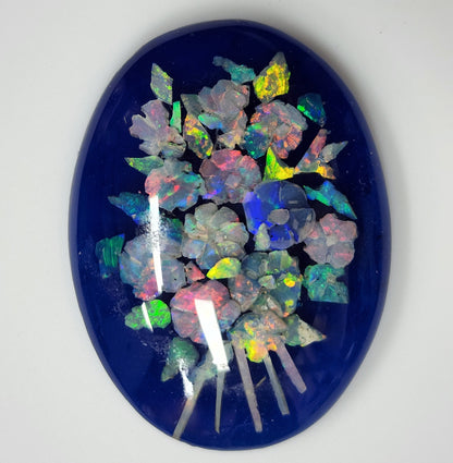 53675.0 - A Boquet of Flowers Created with Carved Australian Opal Chips embedded in Resin against a Blue Background 40x30 mm