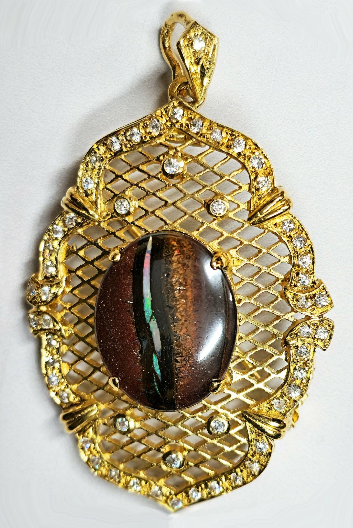 10052.30 - Utvalg av Sterling Sølv Gullbelagt kombinasjonsanheng/brosjesett med Aussie Boulder Opal og CZs valg av Opal kvalitet
