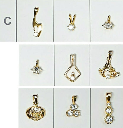 52196.0 - 7 Lots of an assortment of 9 pieces Sterling Silver Pendants Gold Plated set CZ Pendants ranging in size from very small to medium