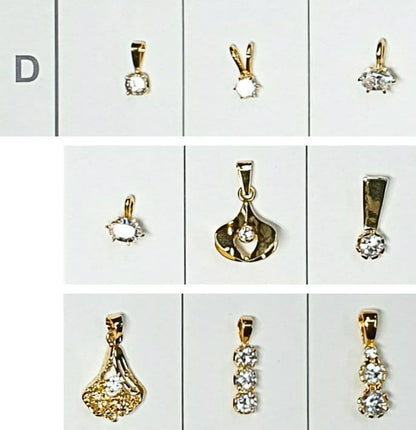52196.0 - 7 Lots of an assortment of 9 pieces Sterling Silver Pendants Gold Plated set CZ Pendants ranging in size from very small to medium