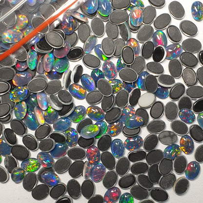 13015.0 - 7x5 mm Oval Cut Australian Opal Triplets Made from Natural Australian Opal for sale in Wholesale quantities at Wholesale prices