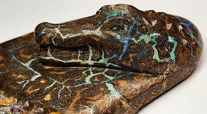 04938.0 - Boulder Opal Carving One pen desk set with two crocodiles on the river bank Opal runs throughout the whole piece
