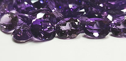 15367.0 - 9x7 mm Oval Cut Medium to Deep Purple Amethyst for sale in Wholesale quantities and at Wholesale prices