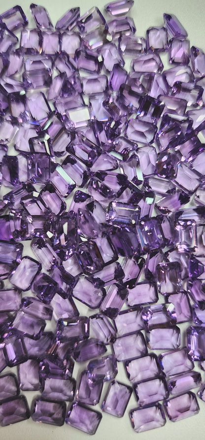 15366.0 - 7 x 5 mm Emerald Cut Amethyst in medium purple colour for sale in wholesale quantity at wholesale prices