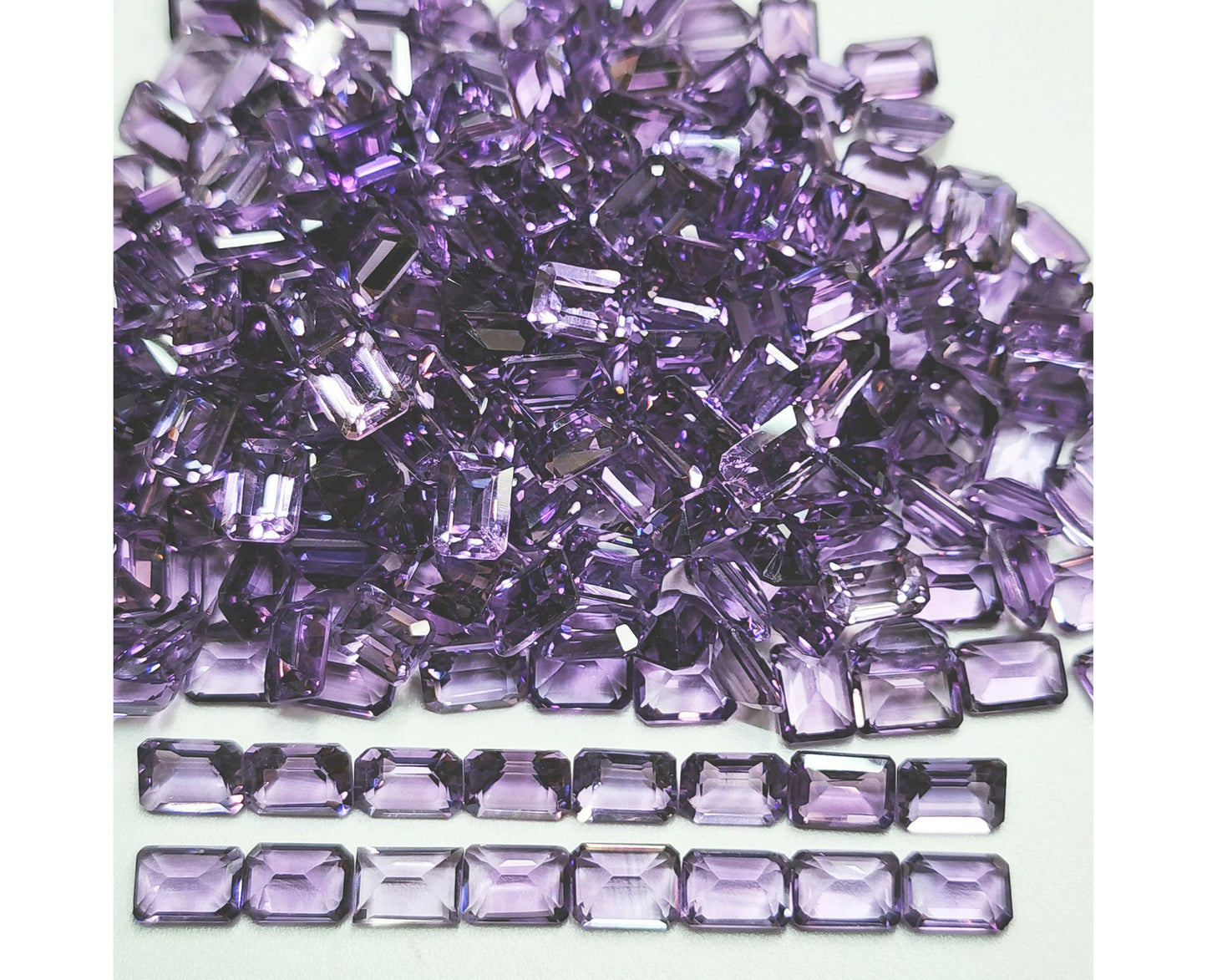 15366.0 - 7 x 5 mm Emerald Cut Amethyst in medium purple colour for sale in wholesale quantity at wholesale prices