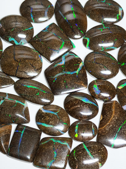 54157.0 - 25 piece lot of rare 1970's Superbly polished Australian Boulder Opal Sizes from 13x10 mm to 25x15 mm 3.0 - 3.5mm thick Flat backs