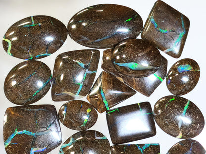 54157.0 - 25 piece lot of rare 1970's Superbly polished Australian Boulder Opal Sizes from 13x10 mm to 25x15 mm 3.0 - 3.5mm thick Flat backs