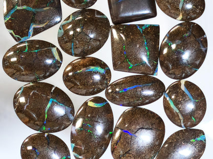 54157.0 - 25 piece lot of rare 1970's Superbly polished Australian Boulder Opal Sizes from 13x10 mm to 25x15 mm 3.0 - 3.5mm thick Flat backs