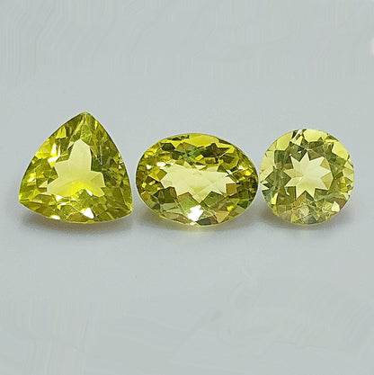 53950.0 - Three Lemon Quartz One Round Cut 11.8 mm 5.86cts One Triliant Cut 13.8 mm 7.61cts One Checker Board Cut Oval 12.5 x 11.5 x 9.2 mm