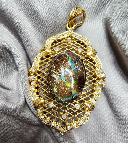 10052.0 - Sterling Silver Gold Plated Combination Penant or Brooch 60 x 35 mm set with 21 x 15 mm One Australian Boulder Opal and CZ