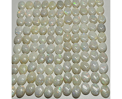 54021.0 - 8x6 mm Wholesale Australian Solid White Oval Cut Cabochon Opal from 1980s for sale All with colour From 1.5 mm to 3.0 mm thick