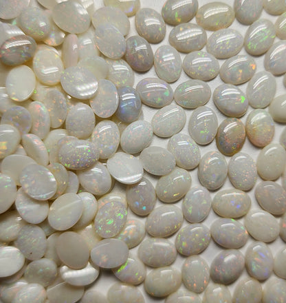 54021.0 - 8x6 mm Wholesale Australian Solid White Oval Cut Cabochon Opal from 1980s for sale All with colour From 1.5 mm to 3.0 mm thick