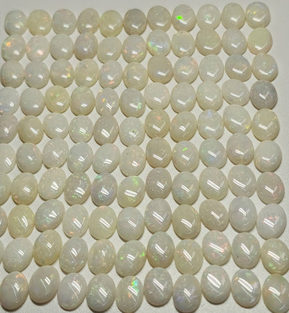 54021.0 - 8x6 mm Wholesale Australian Solid White Oval Cut Cabochon Opal from 1980s for sale All with colour From 1.5 mm to 3.0 mm thick