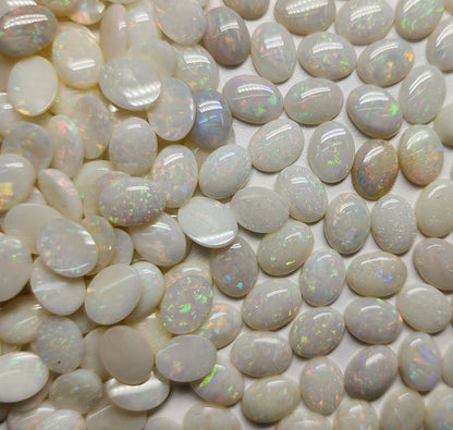 54021.0 - 8x6 mm Wholesale Australian Solid White Oval Cut Cabochon Opal from 1980s for sale All with colour From 1.5 mm to 3.0 mm thick