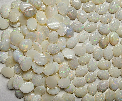 54021.0 - 8x6 mm Wholesale Australian Solid White Oval Cut Cabochon Opal from 1980s for sale All with colour From 1.5 mm to 3.0 mm thick