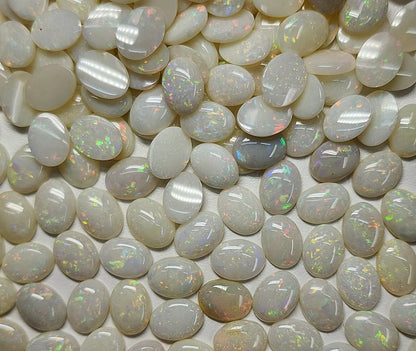 54021.0 - 8x6 mm Wholesale Australian Solid White Oval Cut Cabochon Opal from 1980s for sale All with colour From 1.5 mm to 3.0 mm thick
