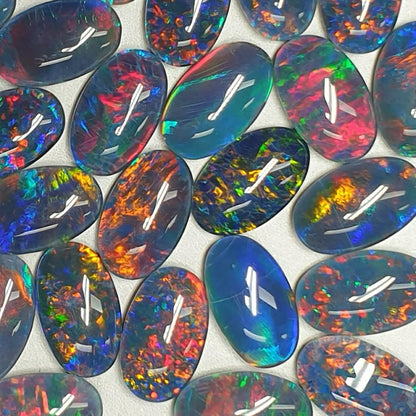 13075.0 - 13x8 mm Oval Shaped Opal Triplet Made from Natural Australian Opal for sale in Wholesale Quantities at Wholesale Prices