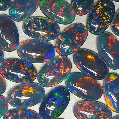 13075.0 - 13x8 mm Oval Shaped Opal Triplet Made from Natural Australian Opal for sale in Wholesale Quantities at Wholesale Prices
