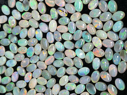 54067.0 - 6x4 mm Oval Cabochon Cut Natural Australian Solid Opal Whole parcel of 180 pieces weighing 49.53 carats or smaller lots for sale