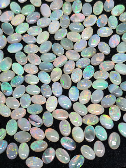 54067.0 - 6x4 mm Oval Cabochon Cut Natural Australian Solid Opal Whole parcel of 180 pieces weighing 49.53 carats or smaller lots for sale