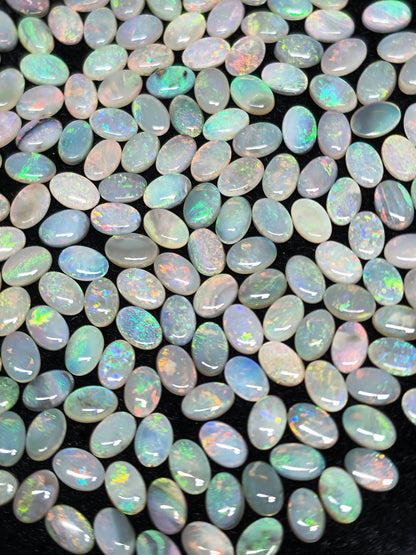 54067.0 - 6x4 mm Oval Cabochon Cut Natural Australian Solid Opal Whole parcel of 180 pieces weighing 49.53 carats or smaller lots for sale
