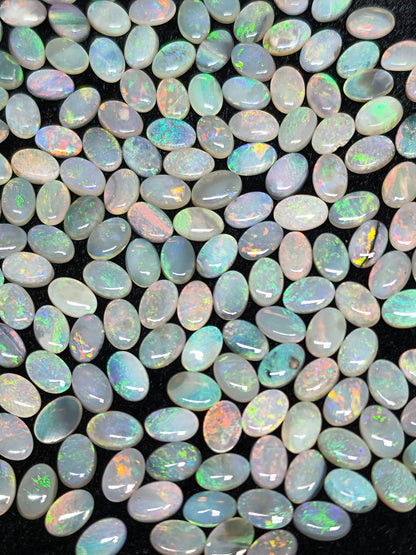 54067.0 - 6x4 mm Oval Cabochon Cut Natural Australian Solid Opal Whole parcel of 180 pieces weighing 49.53 carats or smaller lots for sale