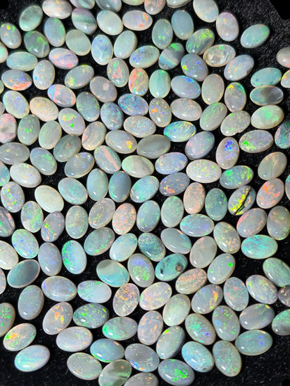 54067.0 - 6x4 mm Oval Cabochon Cut Natural Australian Solid Opal Whole parcel of 180 pieces weighing 49.53 carats or smaller lots for sale