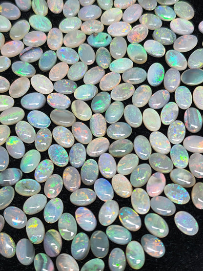 54067.0 - 6x4 mm Oval Cabochon Cut Natural Australian Solid Opal Whole parcel of 180 pieces weighing 49.53 carats or smaller lots for sale