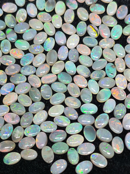 54067.0 - 6x4 mm Oval Cabochon Cut Natural Australian Solid Opal Whole parcel of 180 pieces weighing 49.53 carats or smaller lots for sale