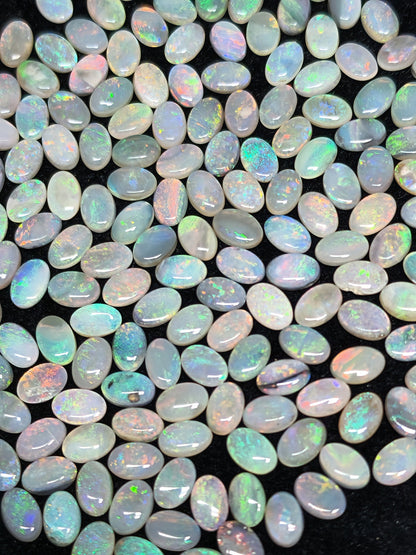 54067.0 - 6x4 mm Oval Cabochon Cut Natural Australian Solid Opal Whole parcel of 180 pieces weighing 49.53 carats or smaller lots for sale