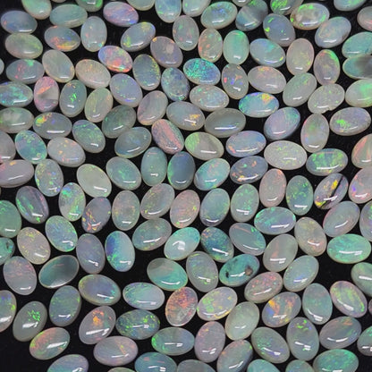 54067.0 - 6x4 mm Oval Cabochon Cut Natural Australian Solid Opal Whole parcel of 180 pieces weighing 49.53 carats or smaller lots for sale